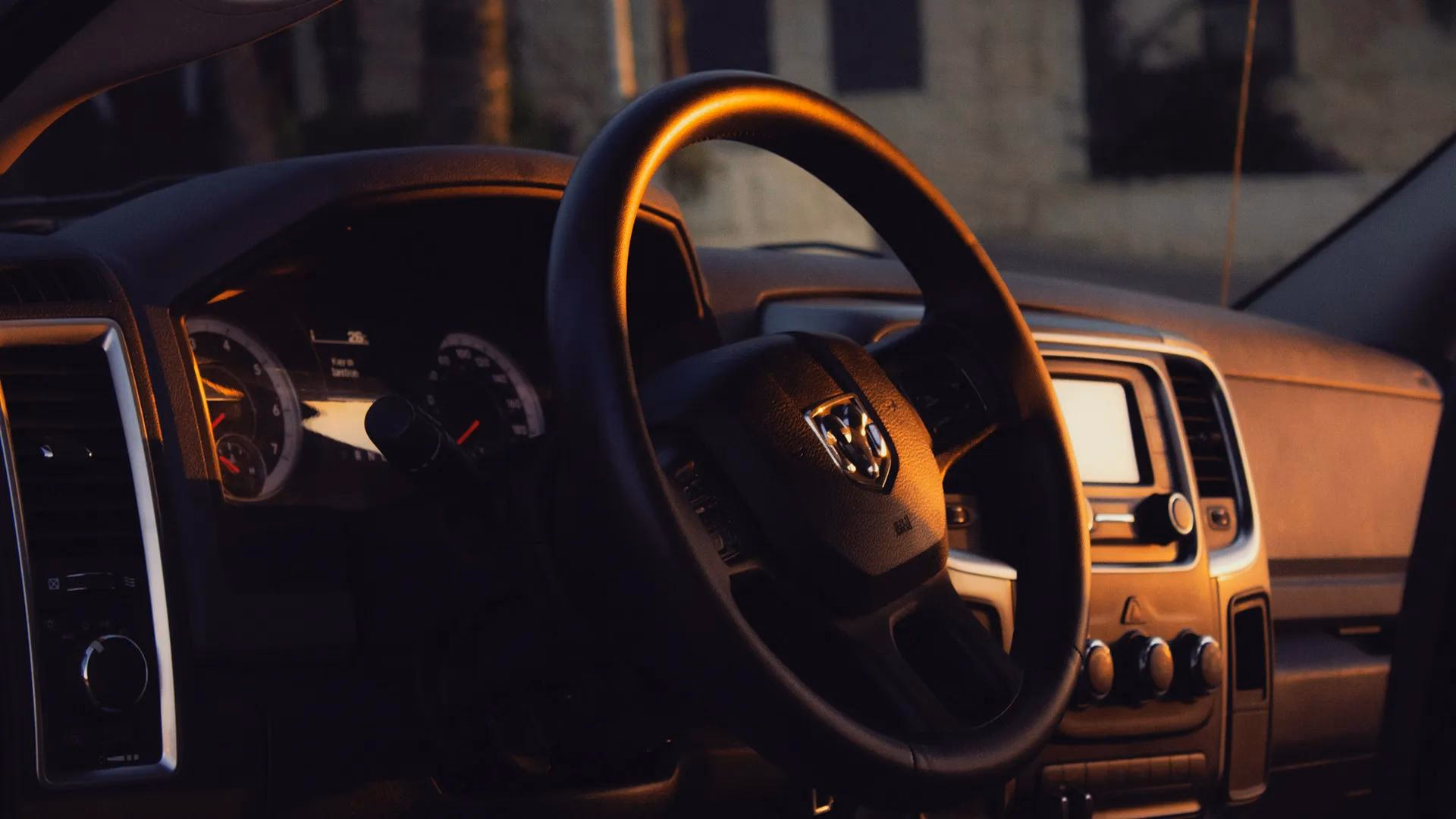 Car window with warm golden-hour light and soft reflections